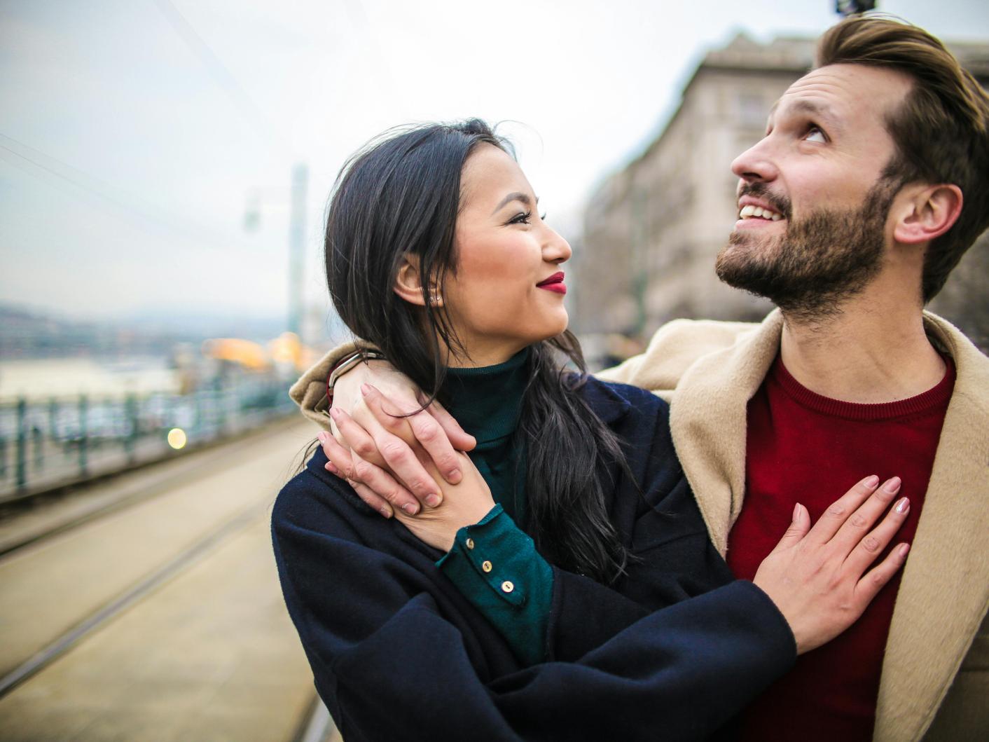 Photo of a man embracing a woman